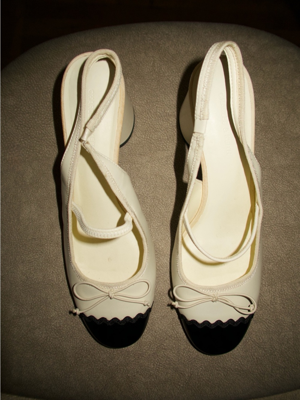 Charles & Keith Cream Slingback Flats with Black Cap Toe and Bow
